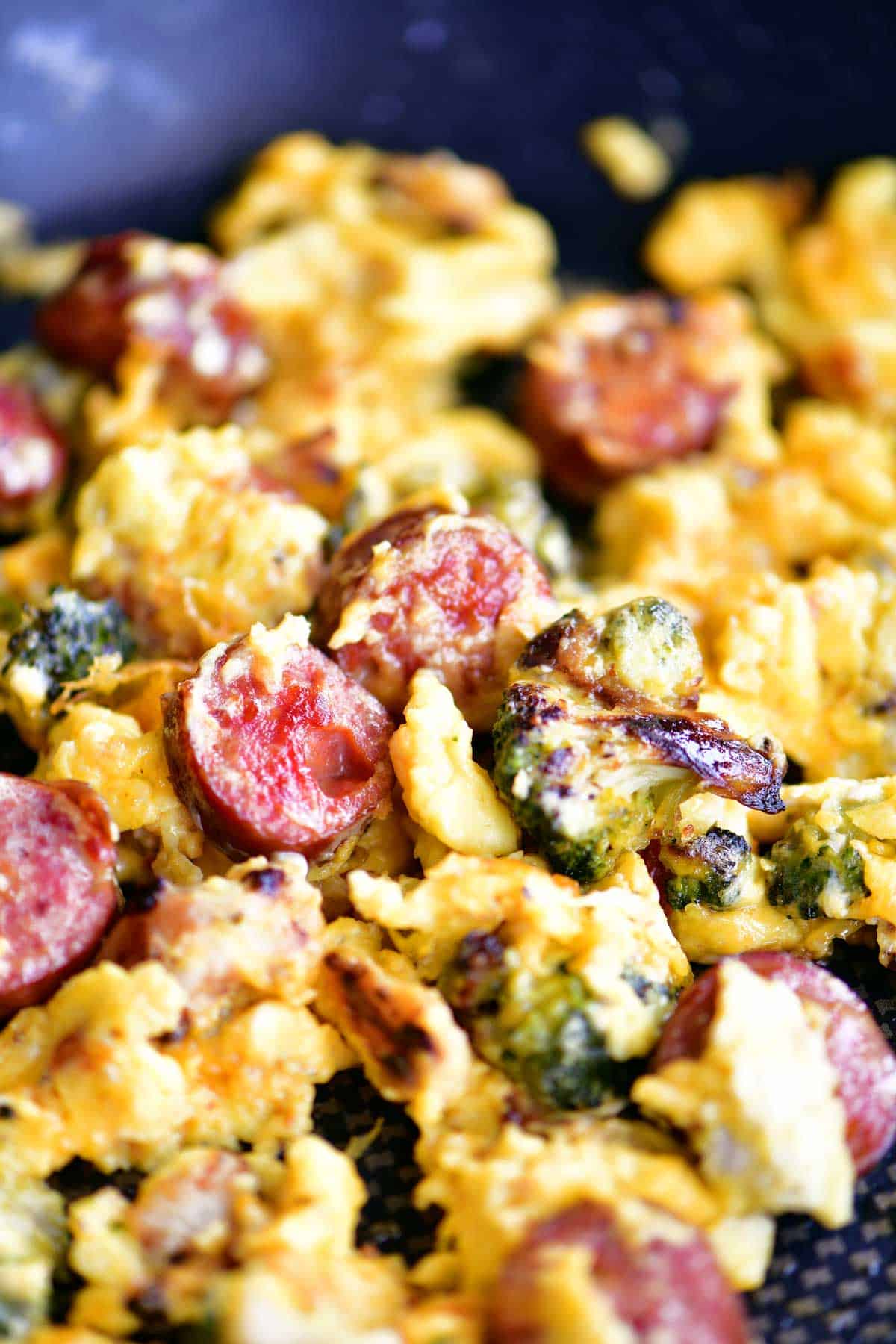 breakfast skillet with scrambled eggs, sausage and vegetables