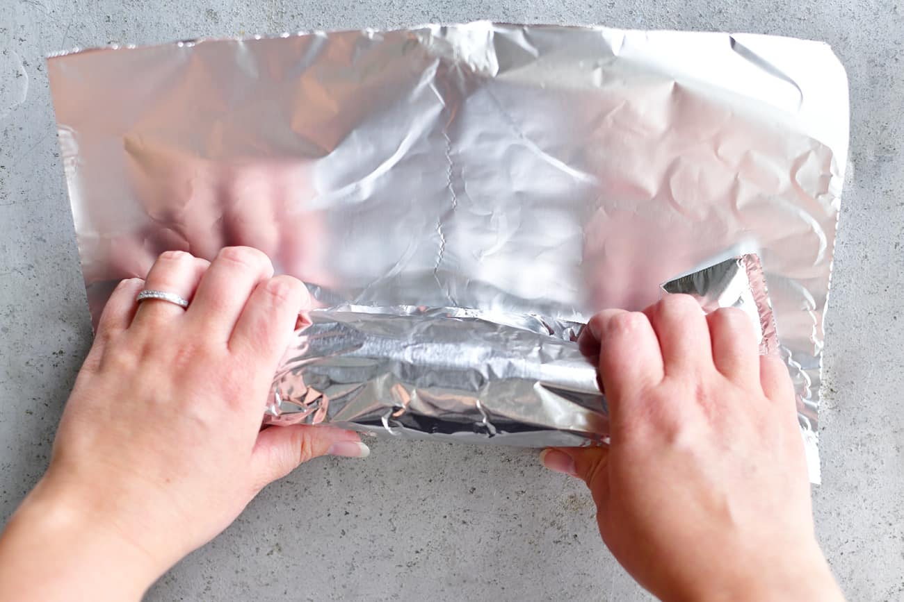 corn on the cob wrapped in foil baked