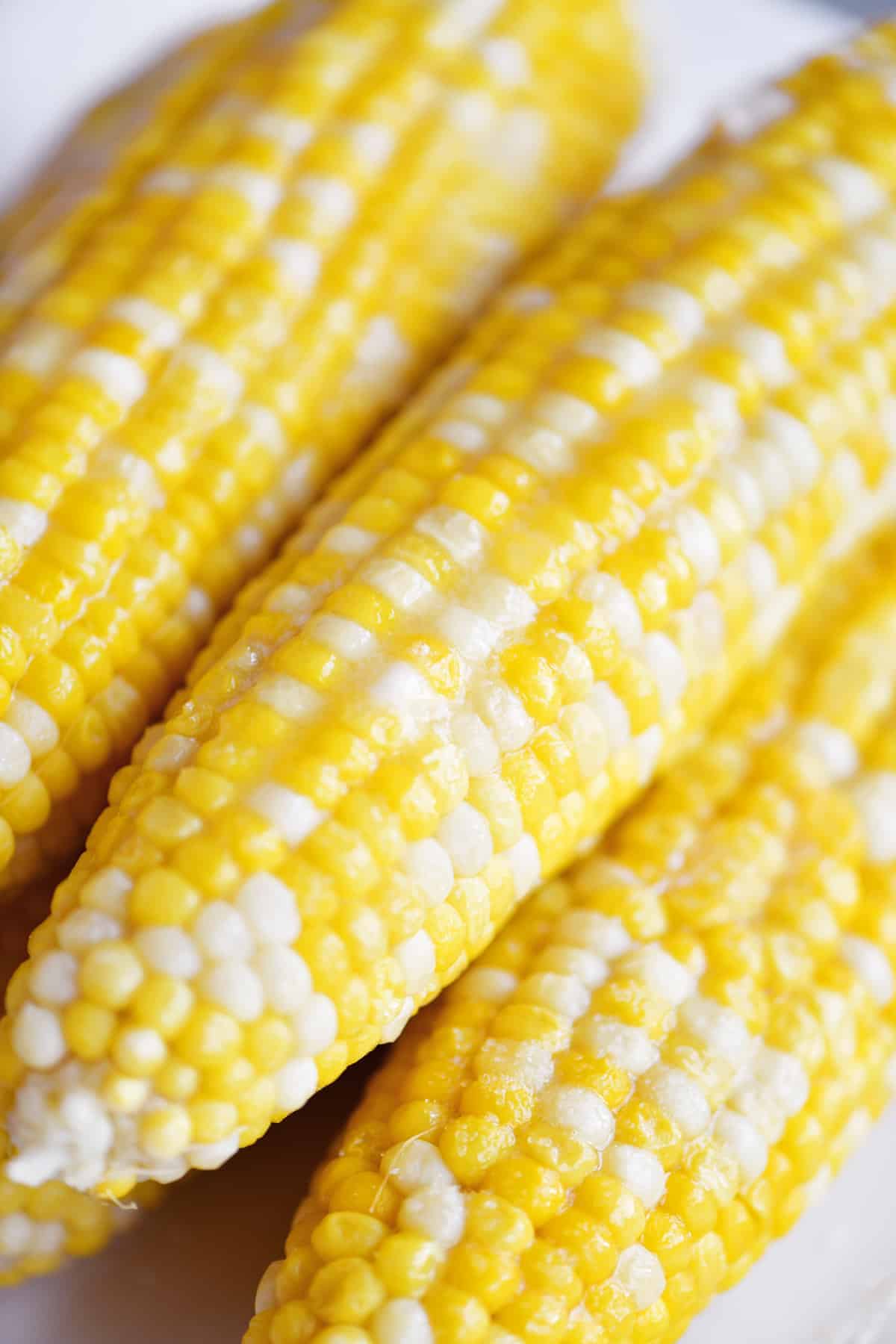 stack of buttered corn on the cob