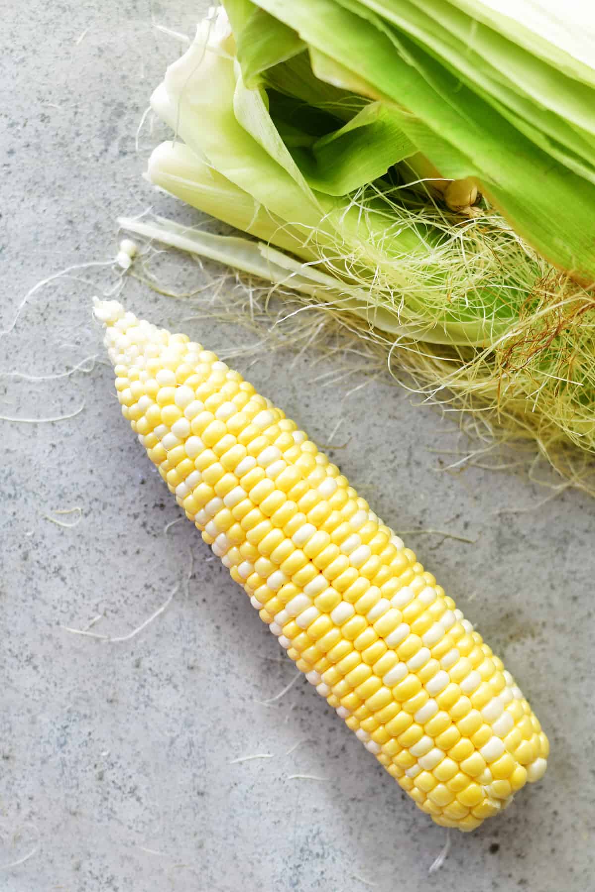peeled corn on the cob for wrapping in foil and roasting in the oven