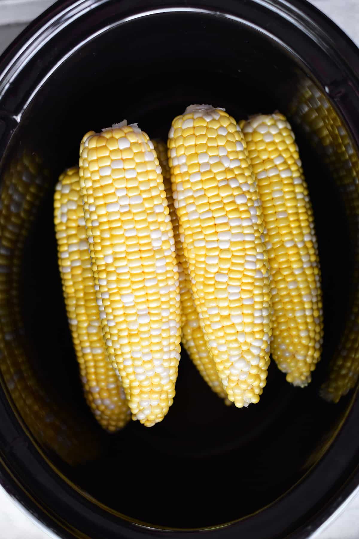 Corn on the cob in a crock pot.