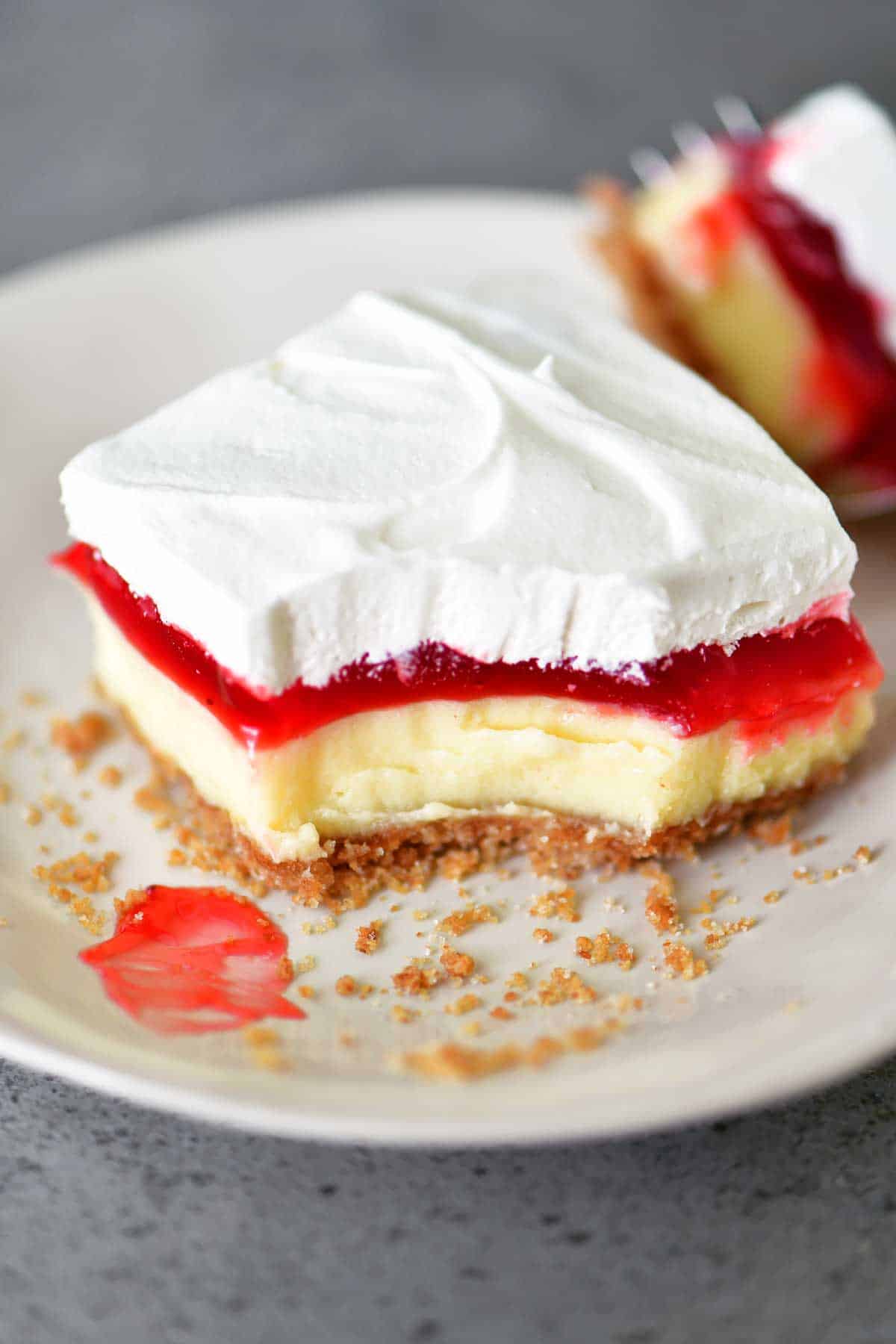 strawberry cheesecake dessert slice on a white plate