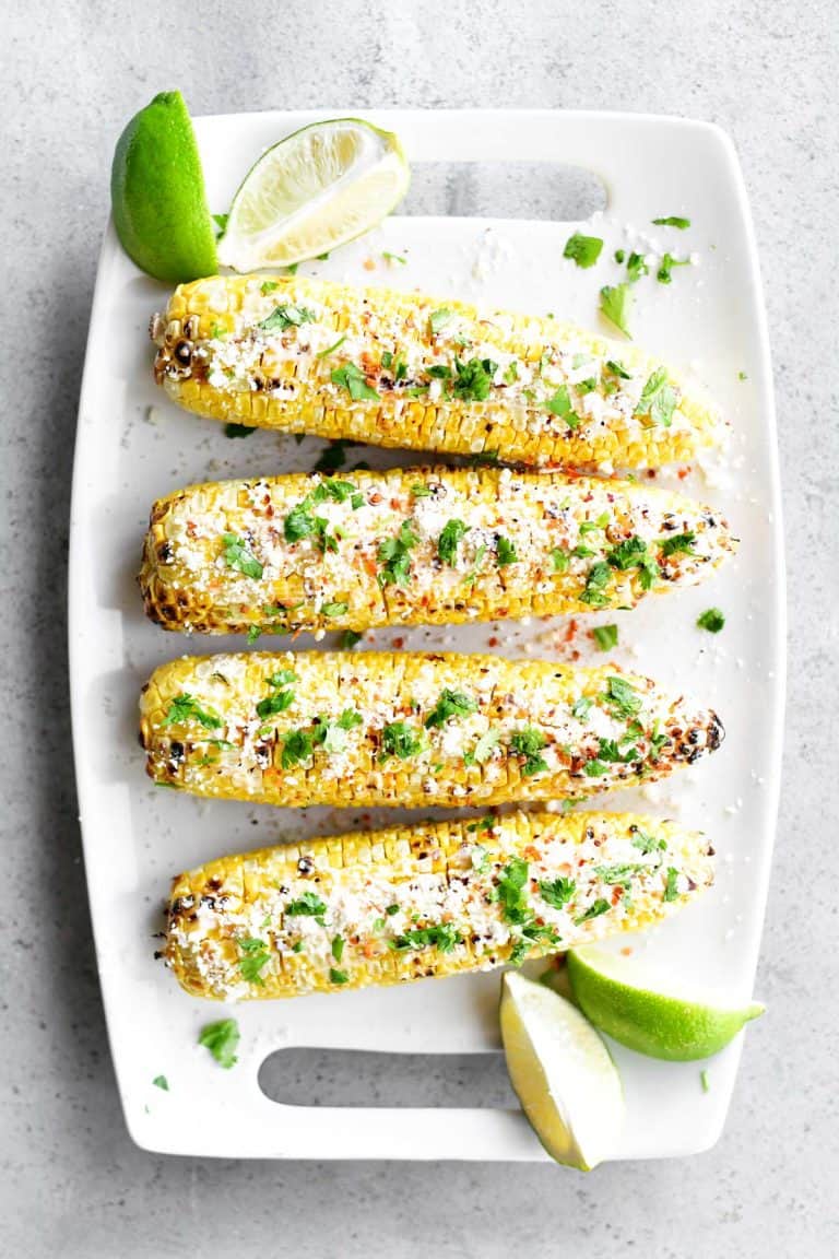 Mexican Street Corn with Spicy Mayo, Cojita Cheese, Chopped Cilantro, and Lime Juice