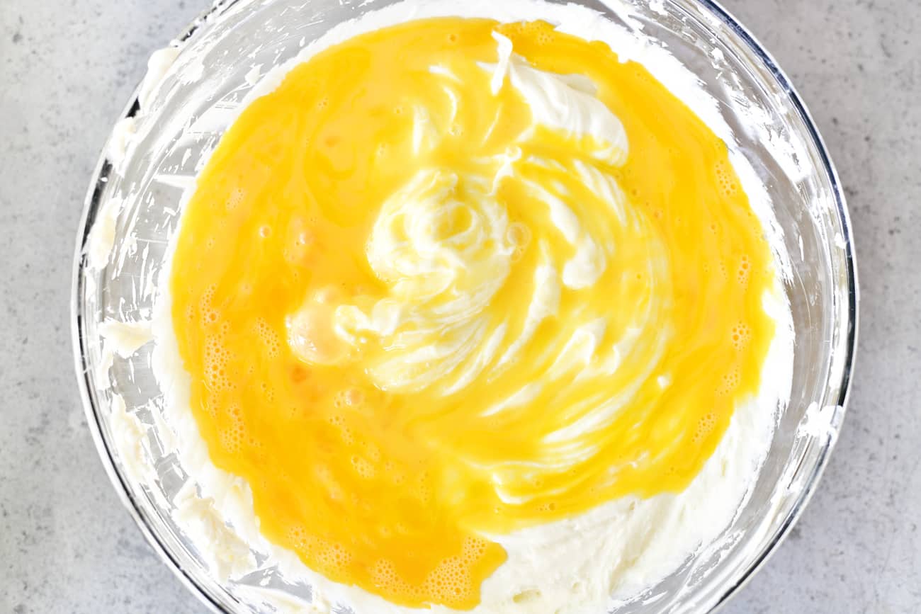 add eggs to pumpkin cheesecake dessert batter