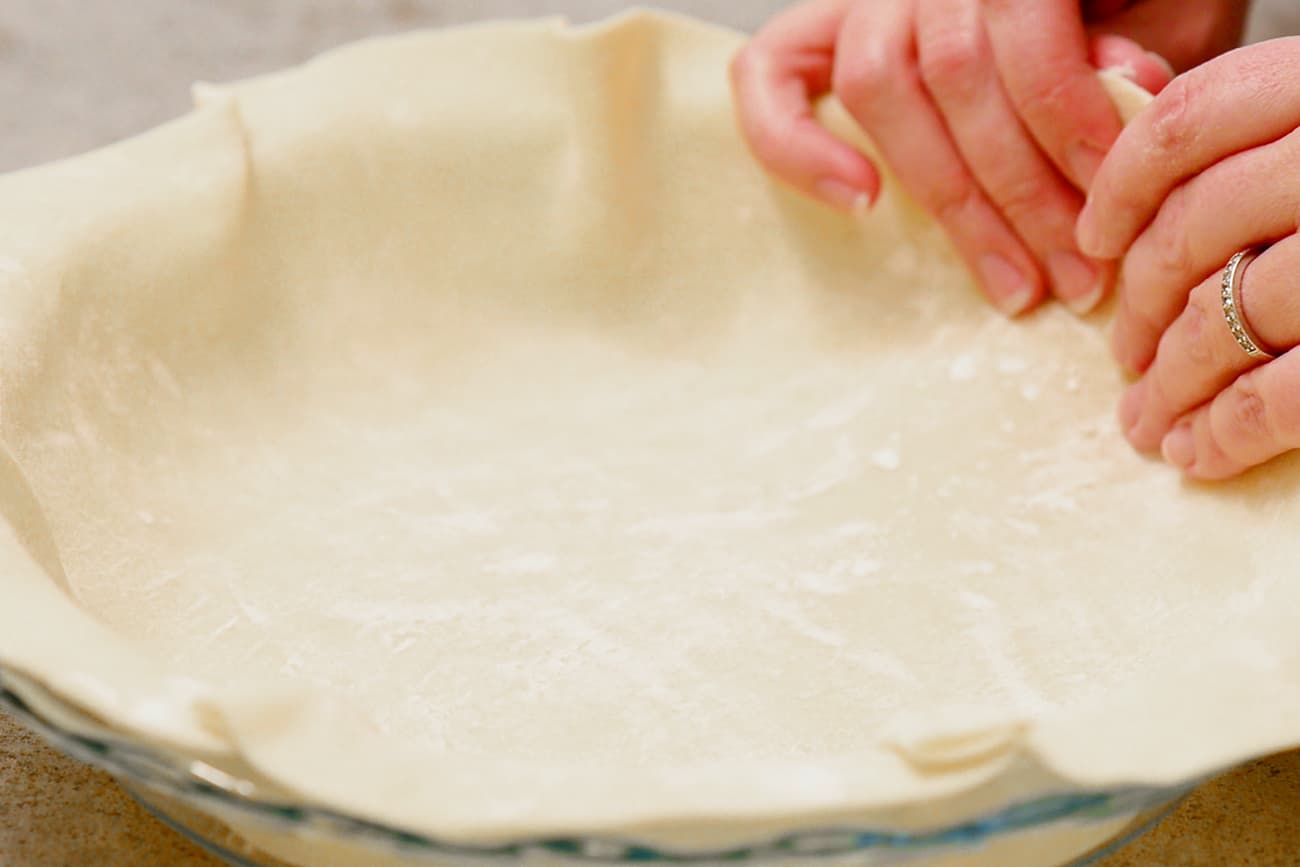 Put the dough into a pan.