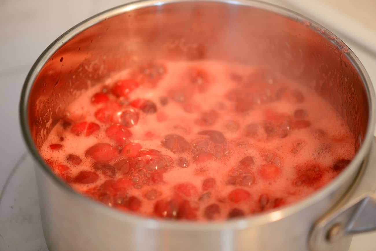 cranberry sauce boiling in saucepan on stovetop