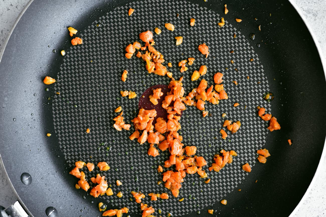 minced carrots in frying pan for pork fried cauliflower rice