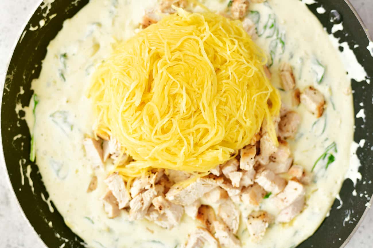 diced chicken and spaghetti squash added to skillet