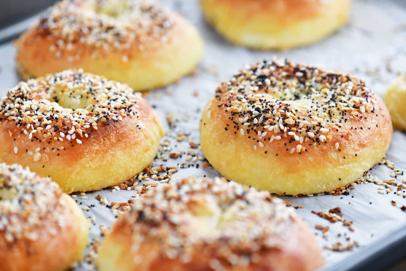 baked low carb bagels with everything seasoning on a baking sheet