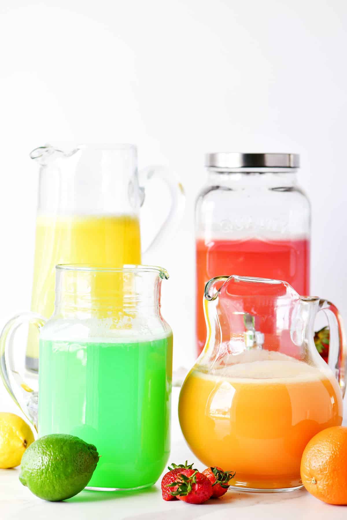 strawberry, orange, lemon and lime sherbet punch in pitchers