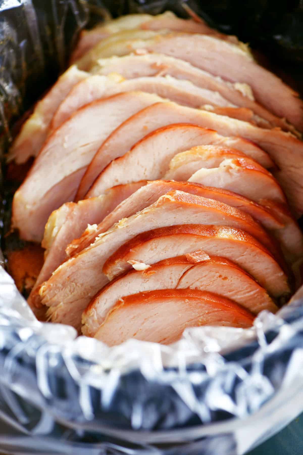 sliced ham in a slow cooker