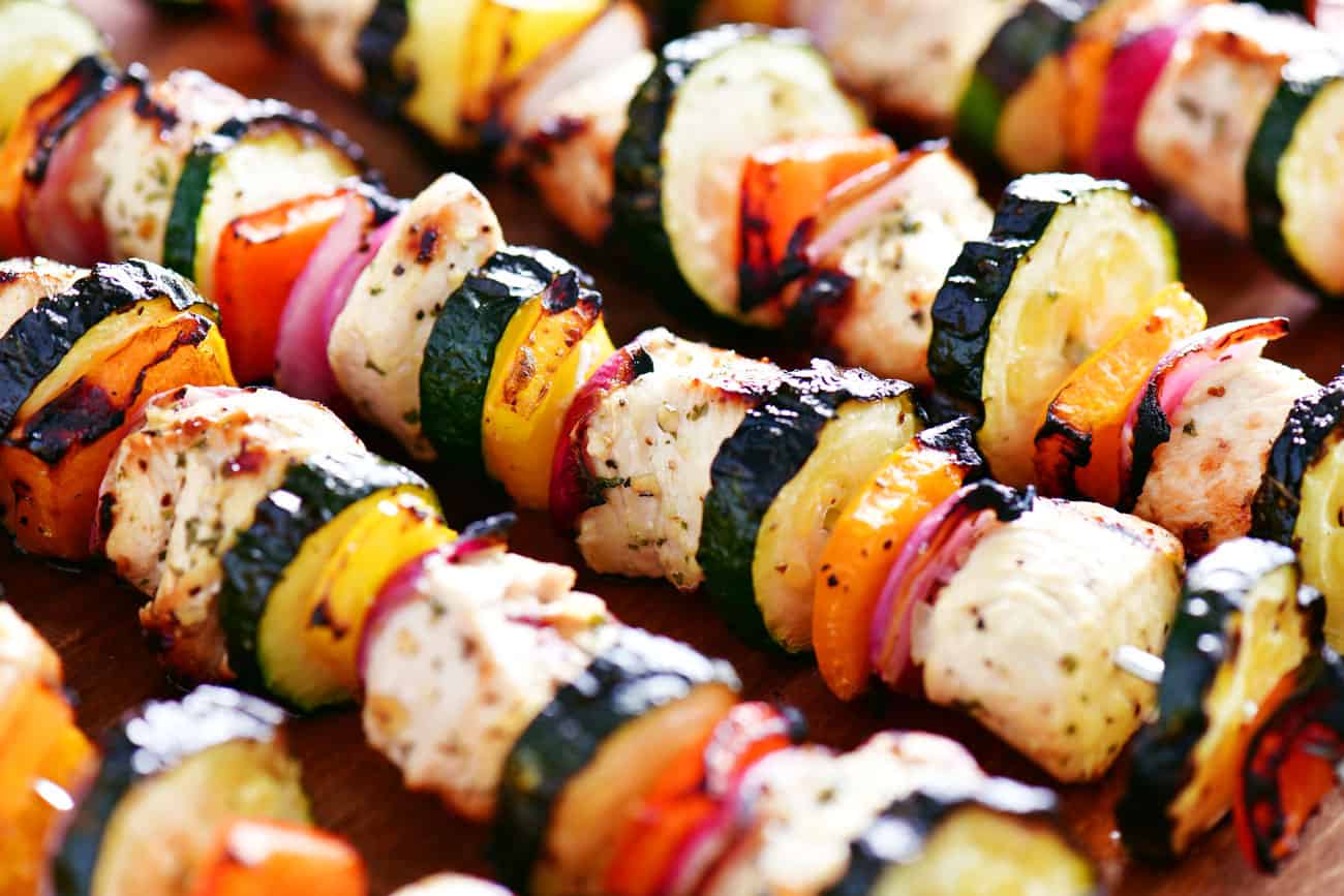 grilled garlic herb chicken kabobs with peppers onions and zucchini