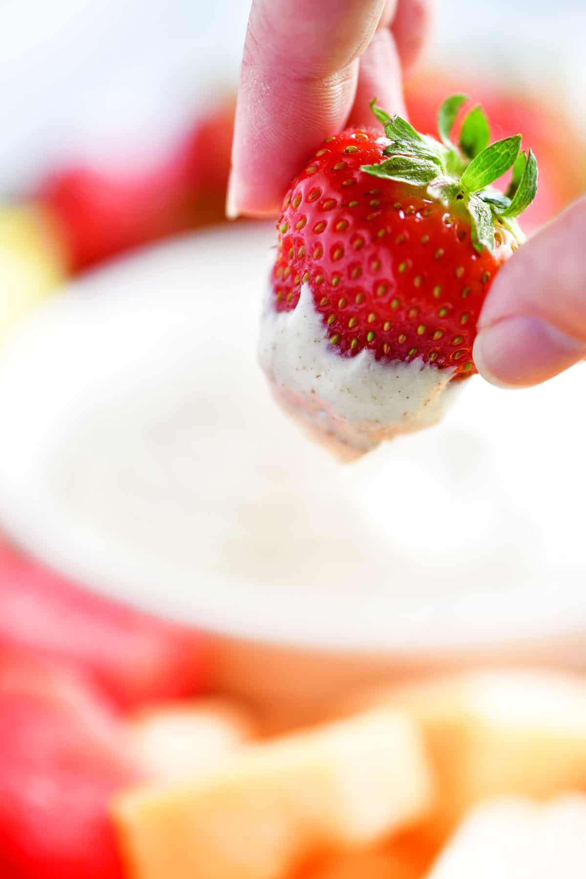 strawberry with fruit dip on it