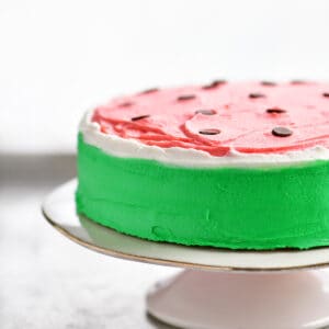 Watermelon cake on a cake stand.