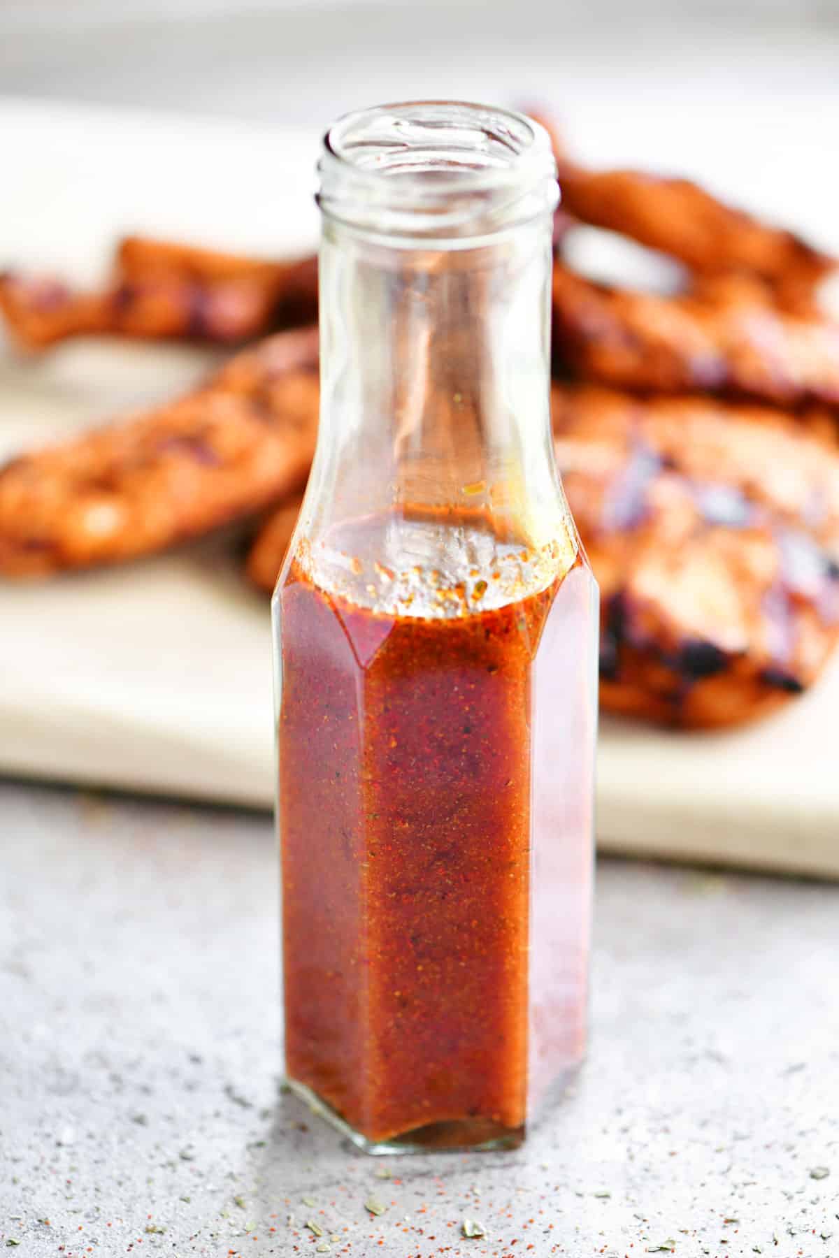 chipotle adobo sauce and chicken in a bottle