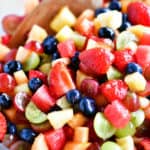 fruit salad in bowl with spoon