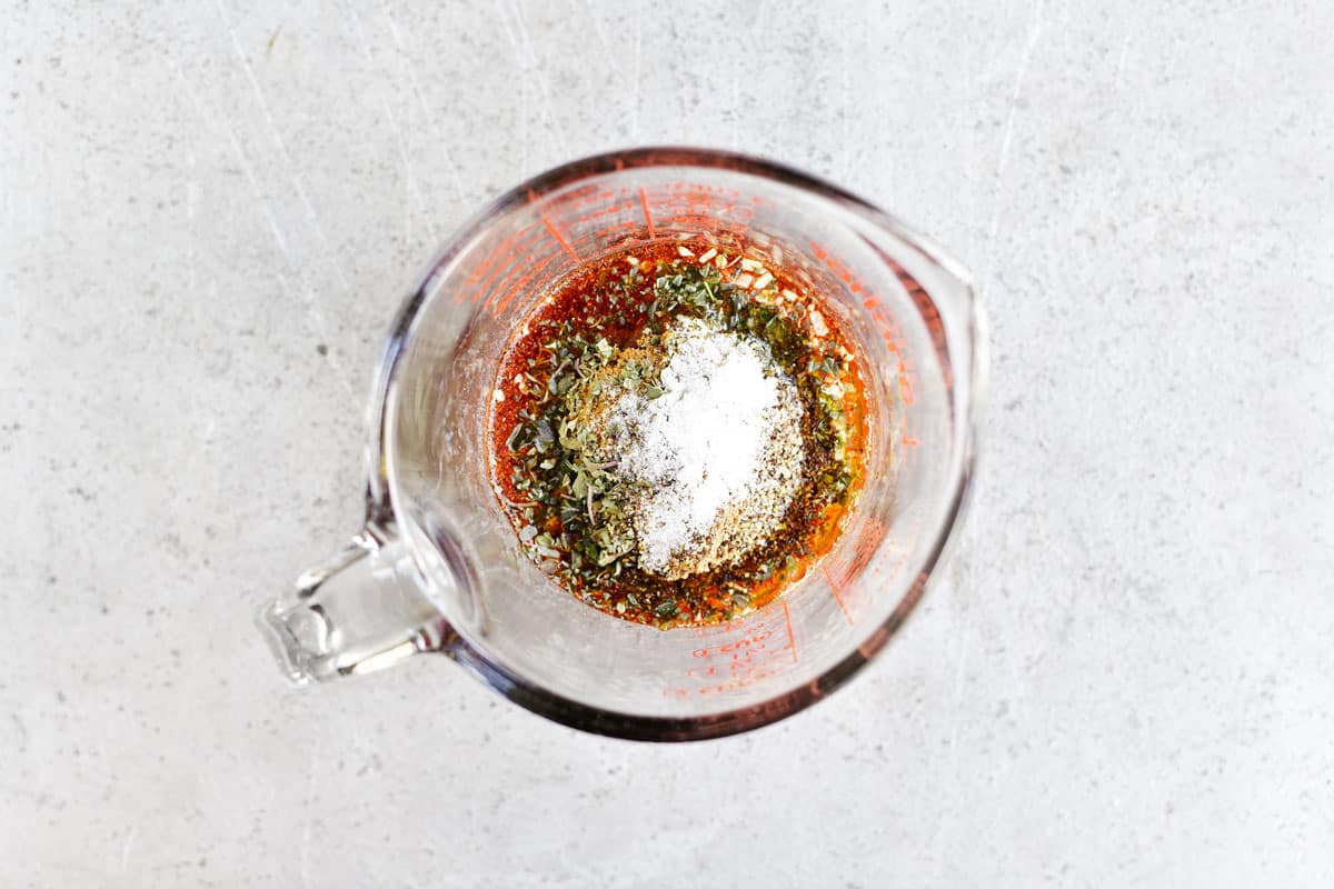 marinade spices in a glass measuring cup