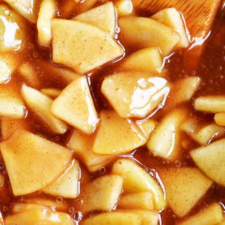 apple pie filling with wooden spoon