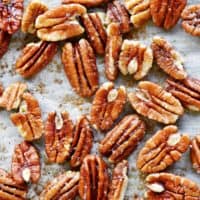 toasted pecans on parchment paper