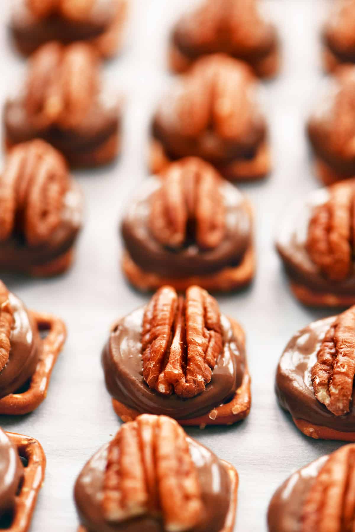 pecans pressed into softened chocolate