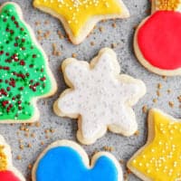 baked cut out sugar cookies with icing and spinkles.