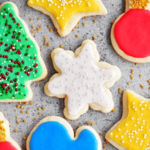 Baked cut out sugar cookies with icing and spinkles.