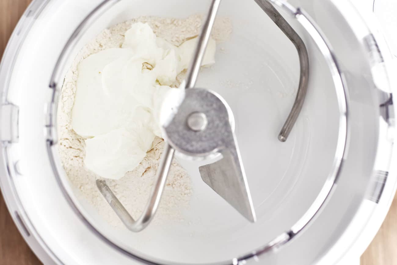self-rising flour and Greek yogurt in a mixing bowl