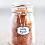 savory dry rub in a small glass jar with label