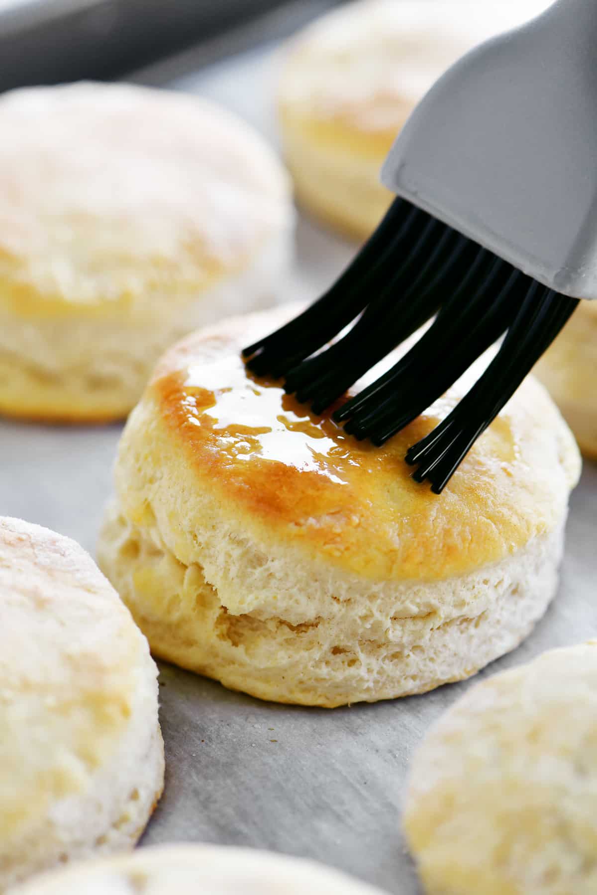 brushing biscuit with melted butter