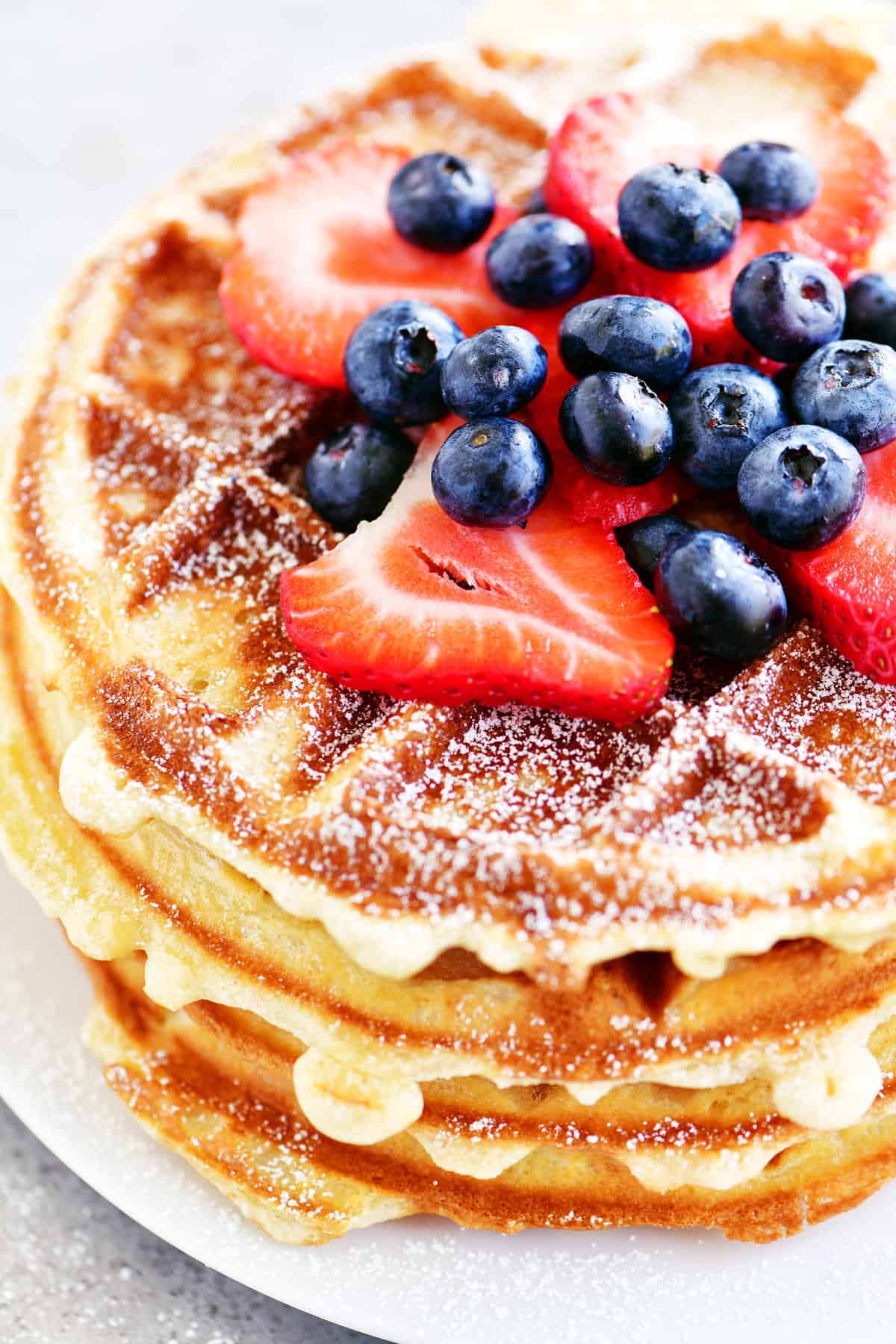 berries on a stack of bisquick waffles