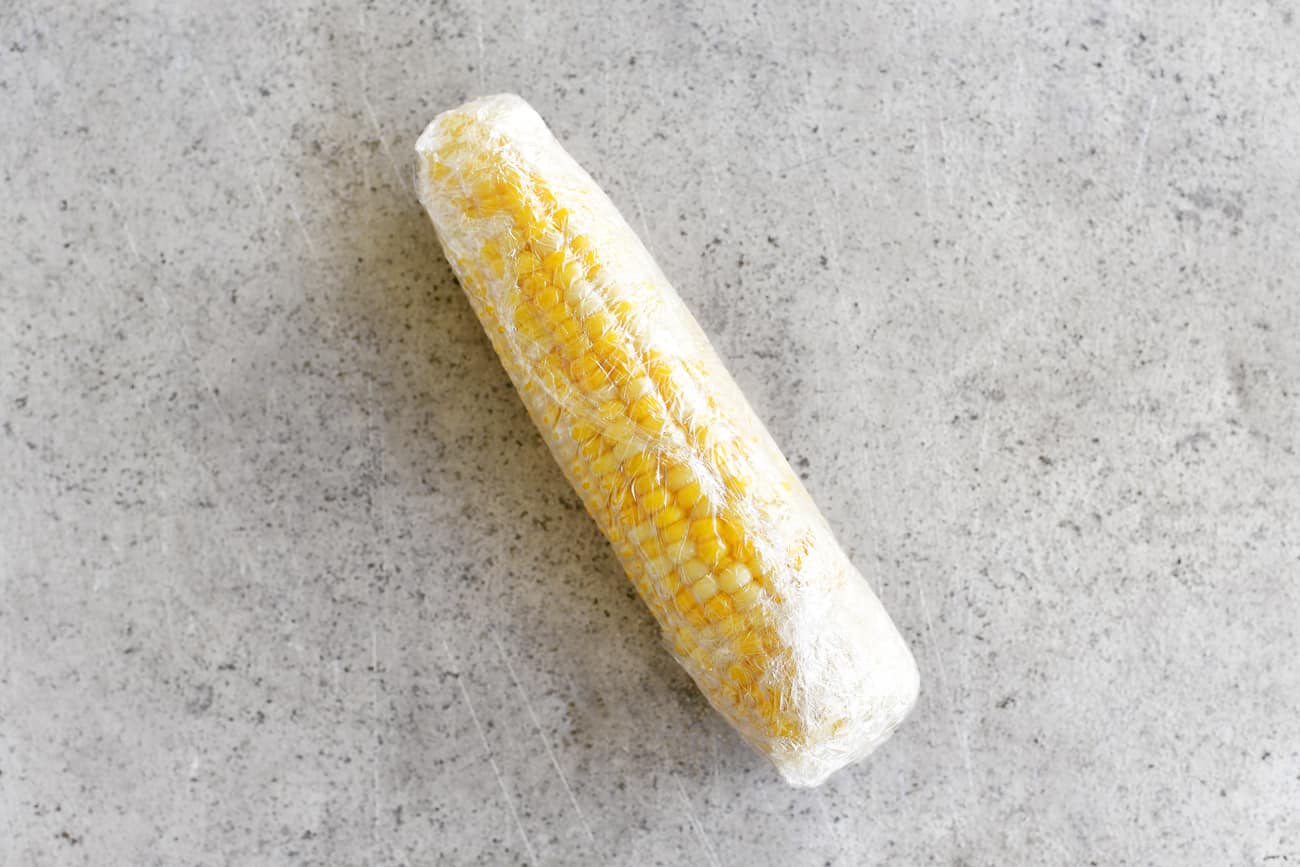 corn on the cob wrapped in plastic