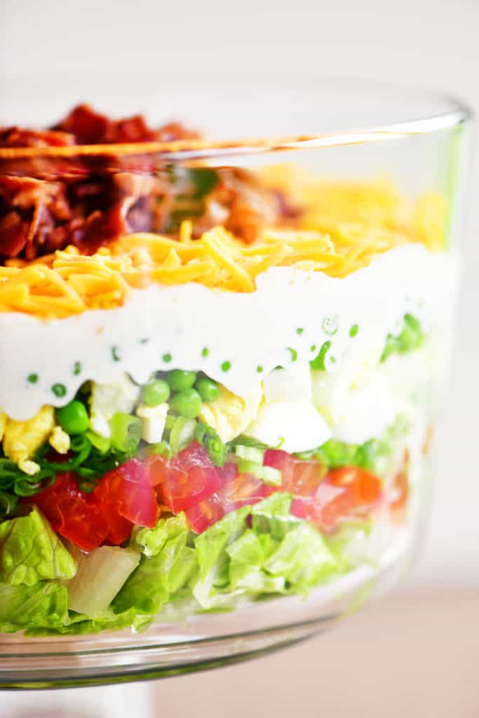 seven layer salad in glass bowl