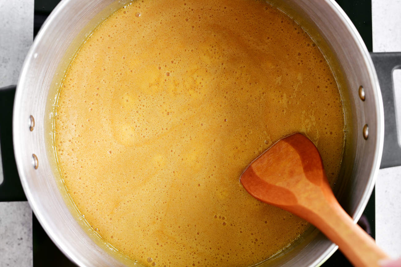 boiling golden sauce in pot