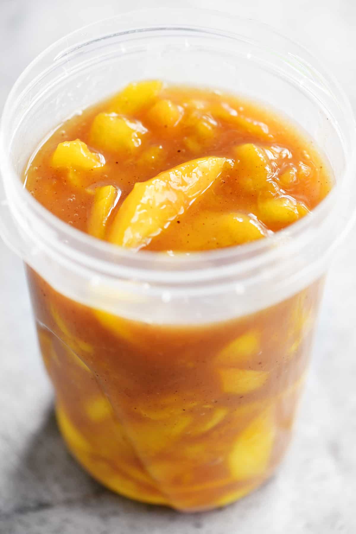 filled container of peach pie filling