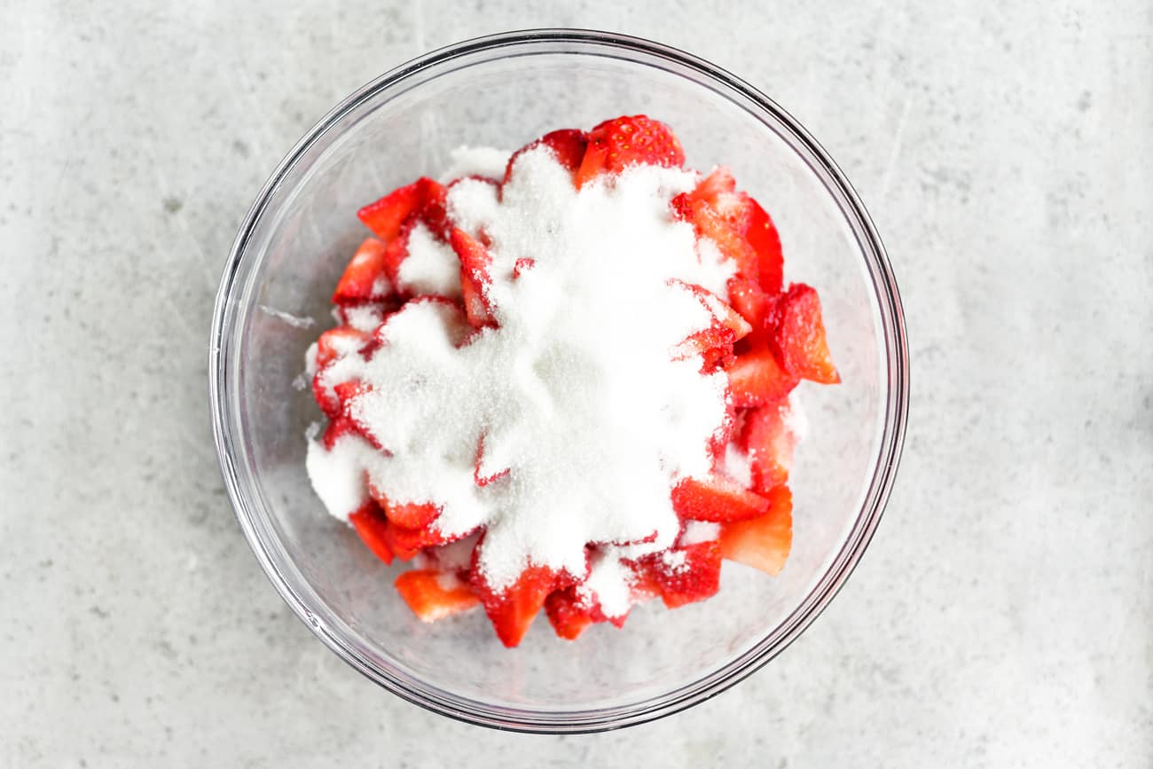 sugar on strawberries on a bowl