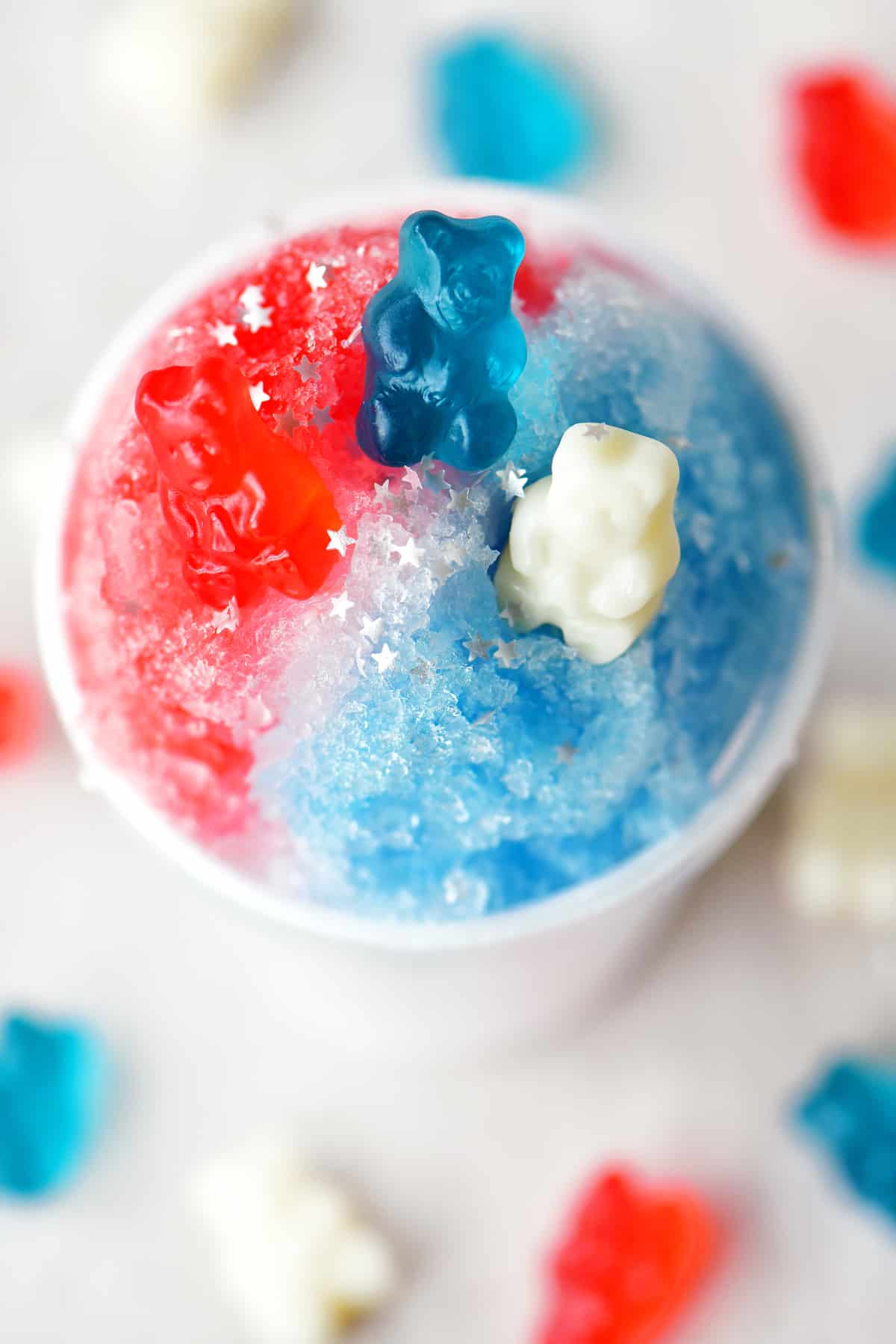 a top-down view of a red, white and blue shave ice treat