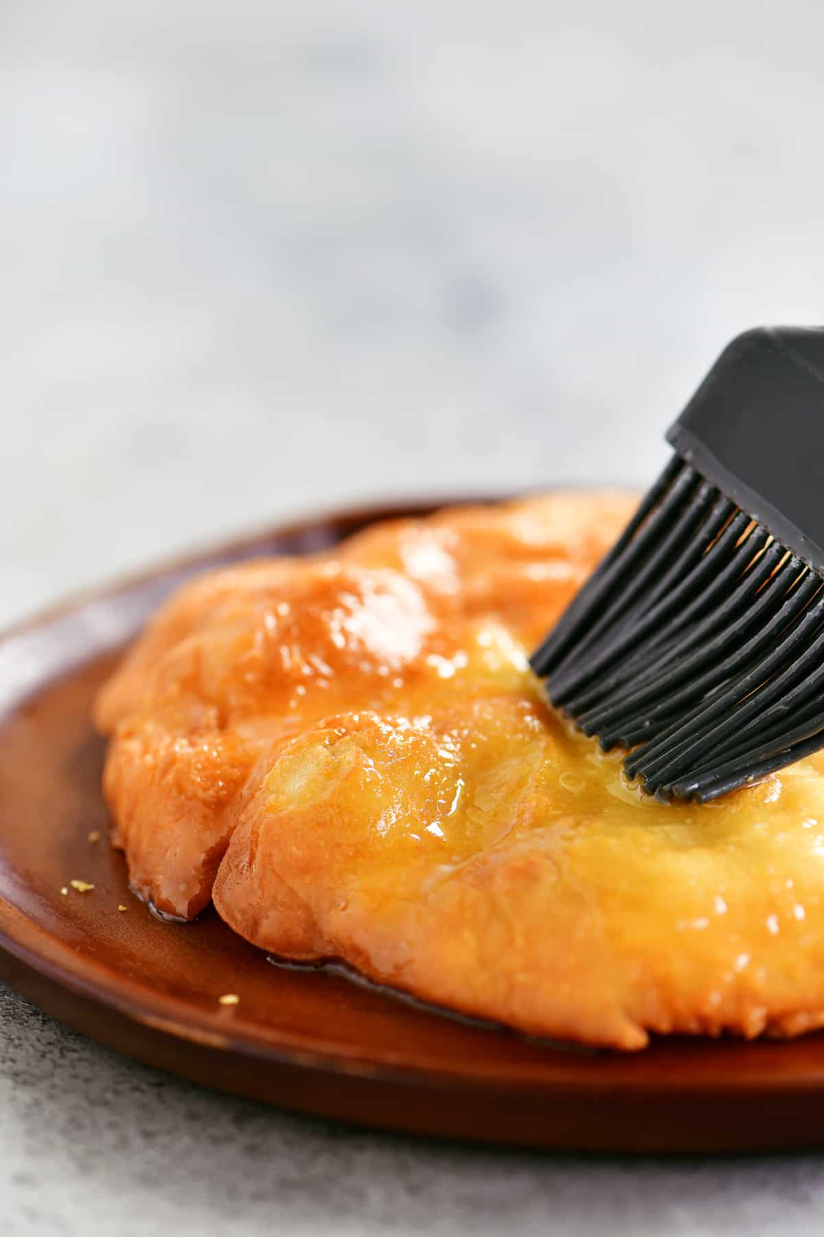 brushing butter on fry bread