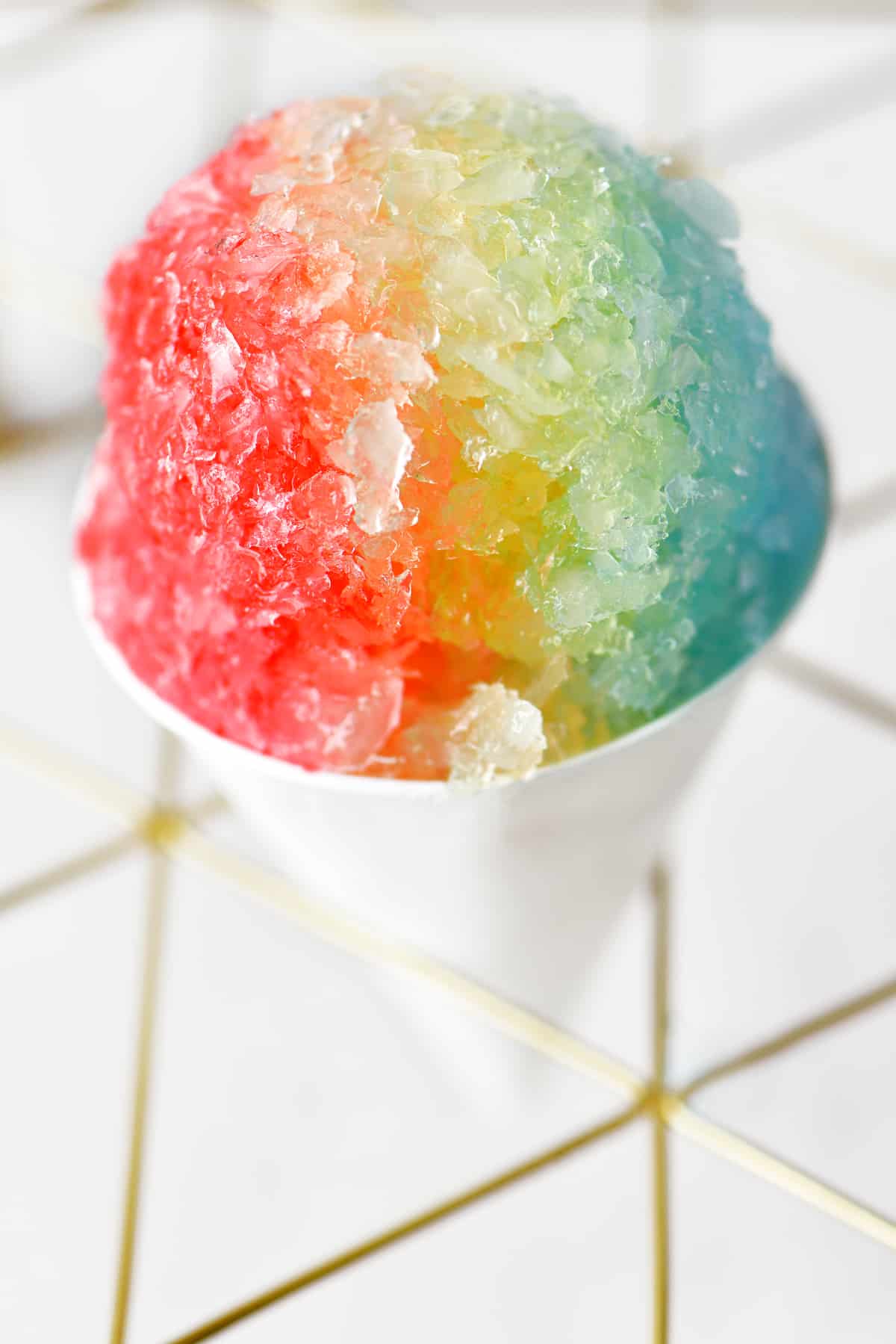a red, yellow and blue snow cone
