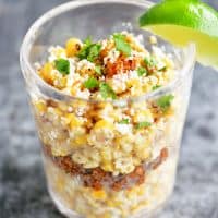 corn in a cup with lime wedge
