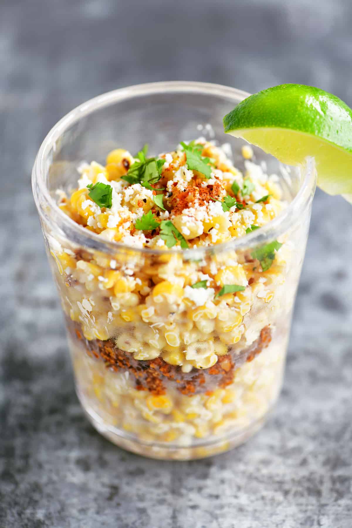 corn in a cup with lime wedge