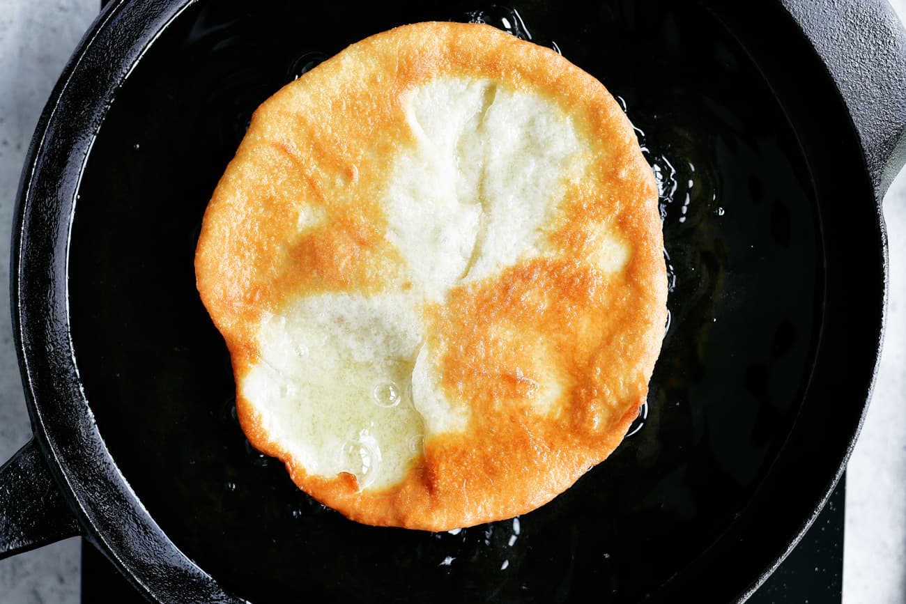 frying dough in cast iron skillet