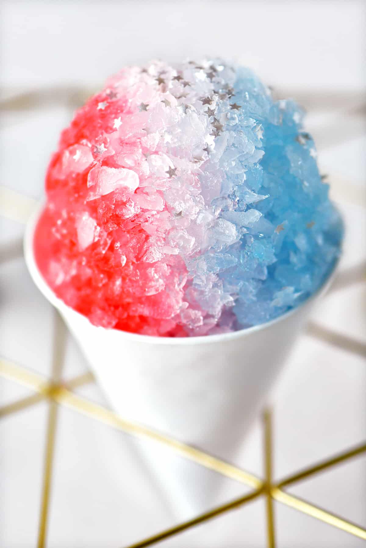 a red, white, and blue snow cone