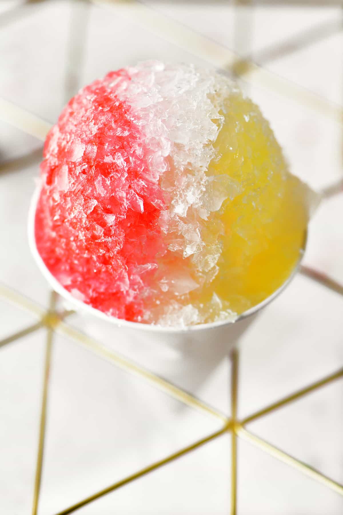 a red white and yellow snow cone