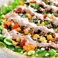 a close up photo of taco salad in a bowl
