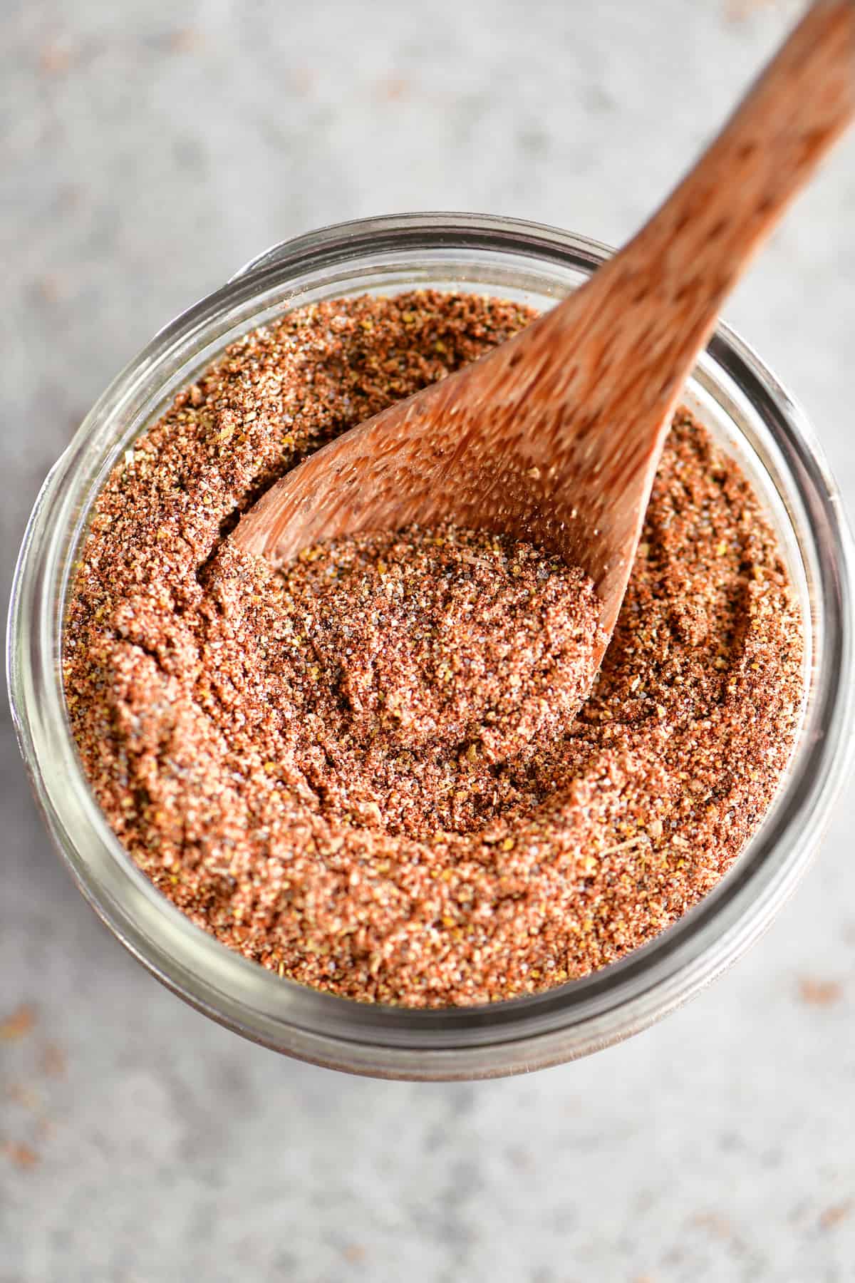 wooden spoon in jar of spices