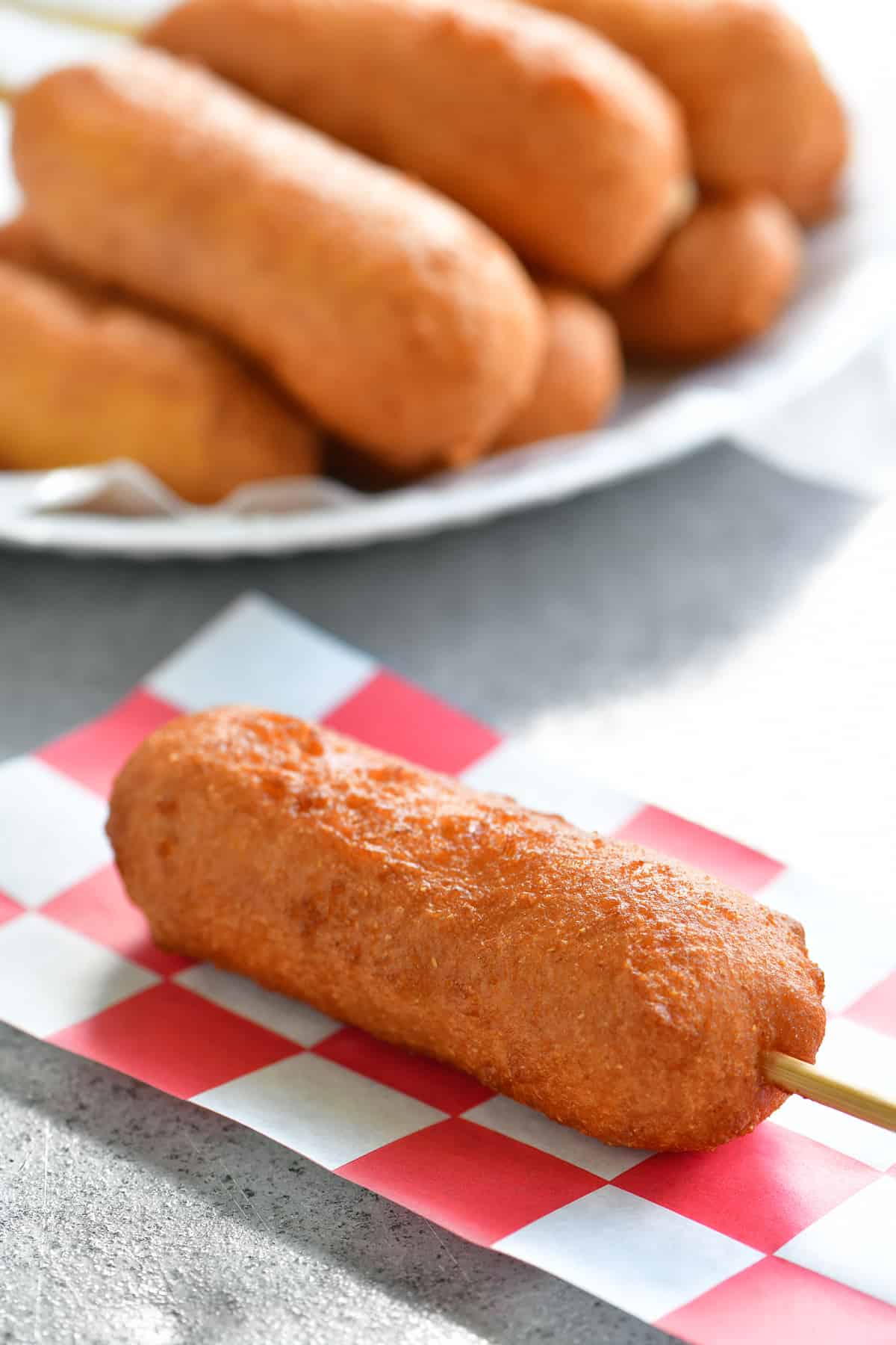 close up photo of fried cheese on a stick