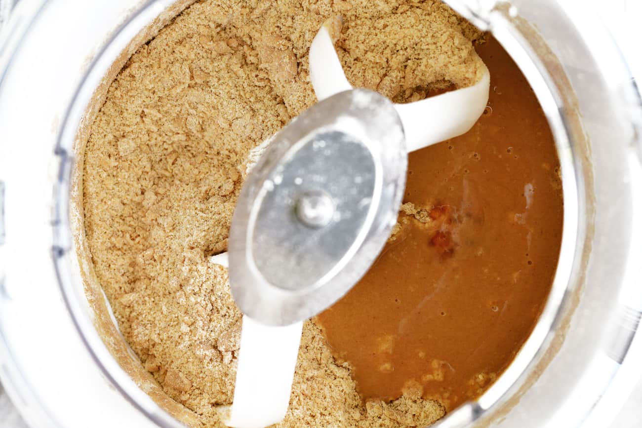 mixing the apple cider donut ingredients with a counter top mixer
