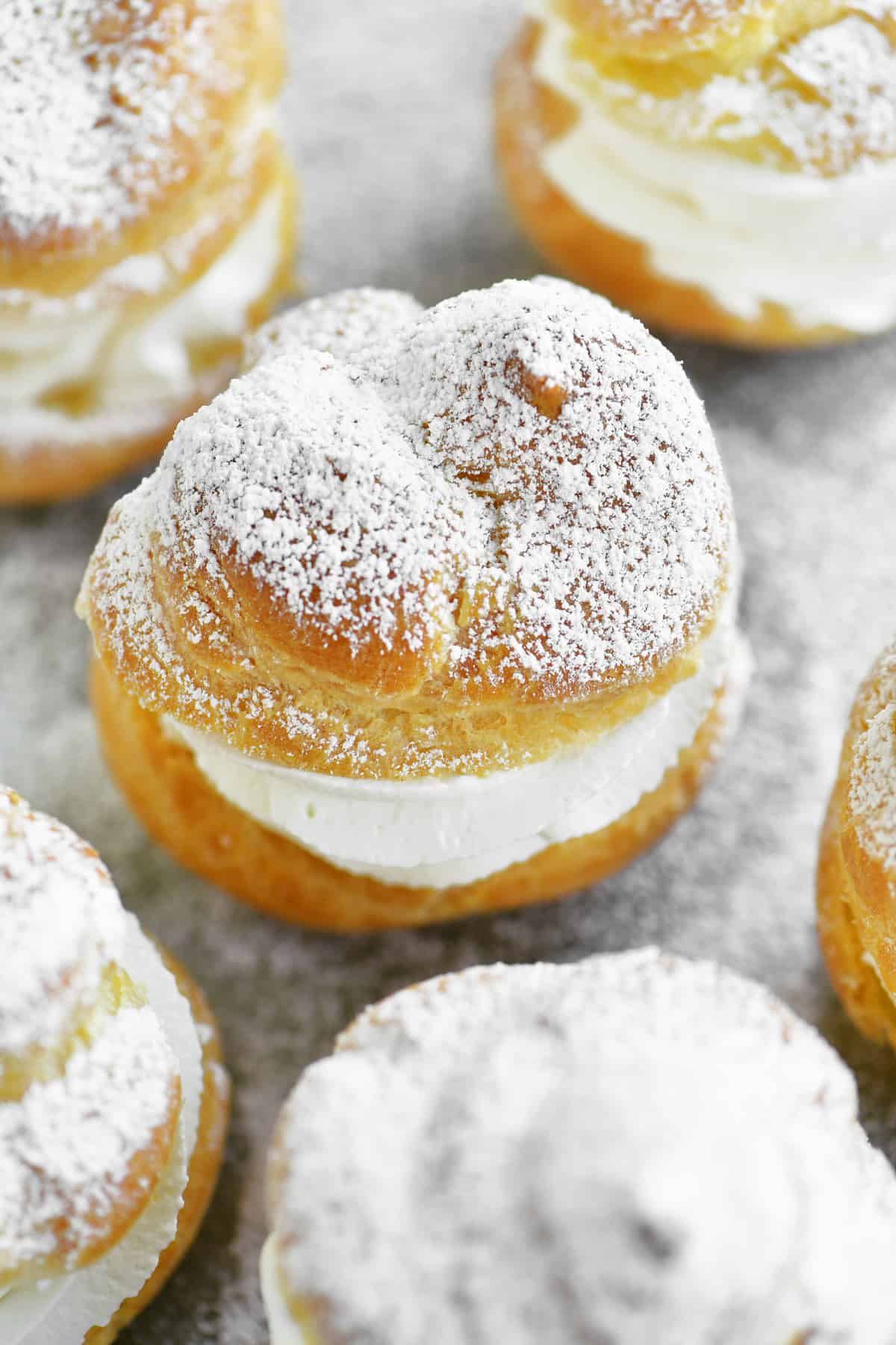 cream puffs with powdered sugar on top