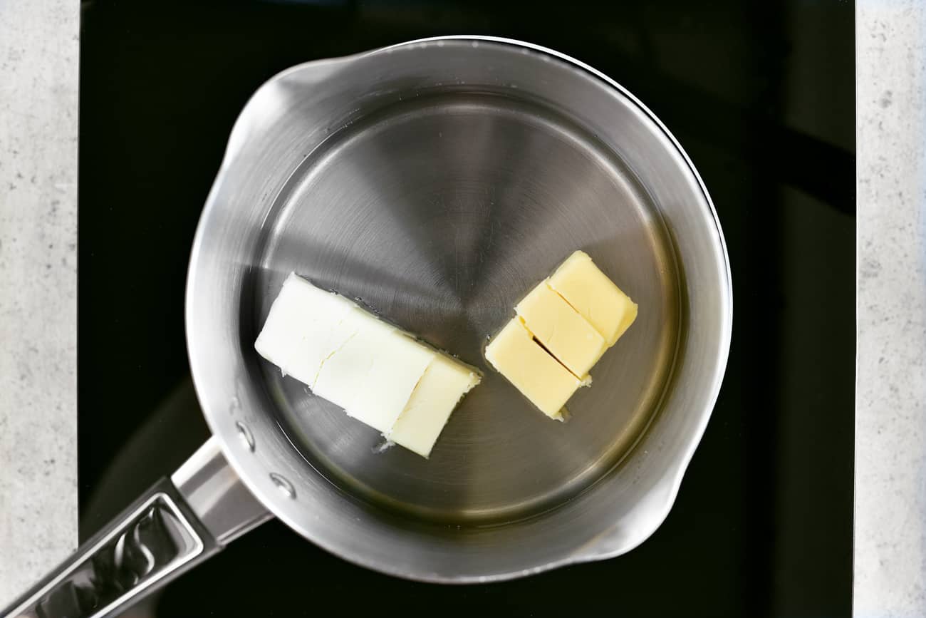butter pats in a saucepan