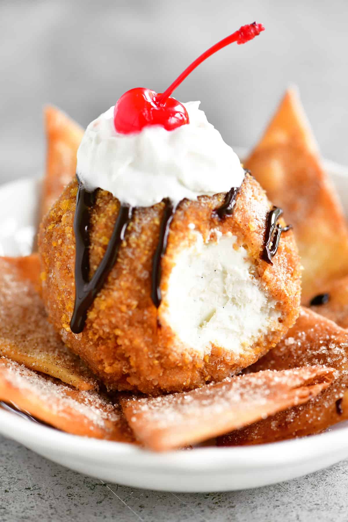 fried ice cream drizzled in chocolate sauce